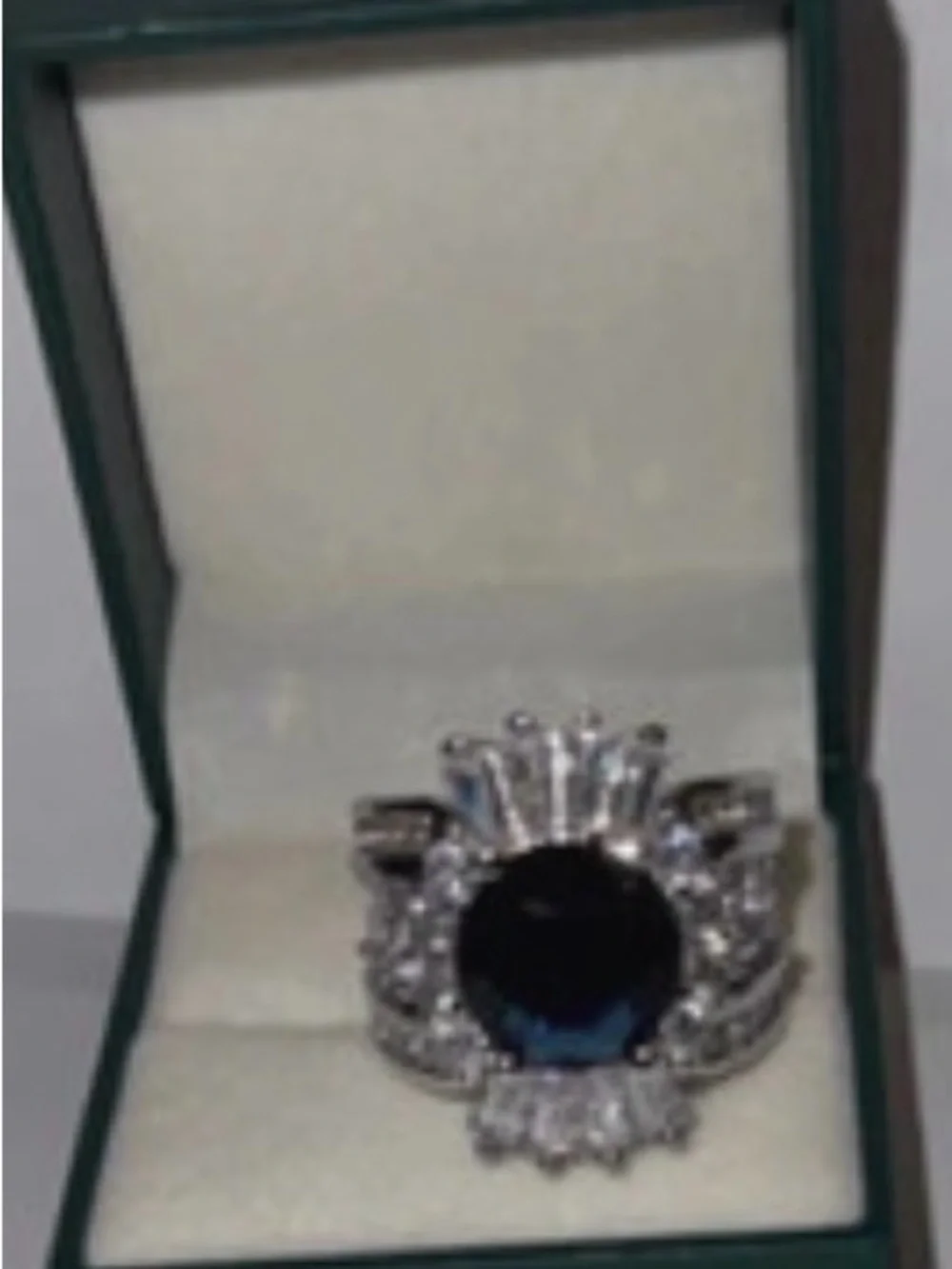 Elegant Silver Cocktail Ring with Deep Blue Center Stone